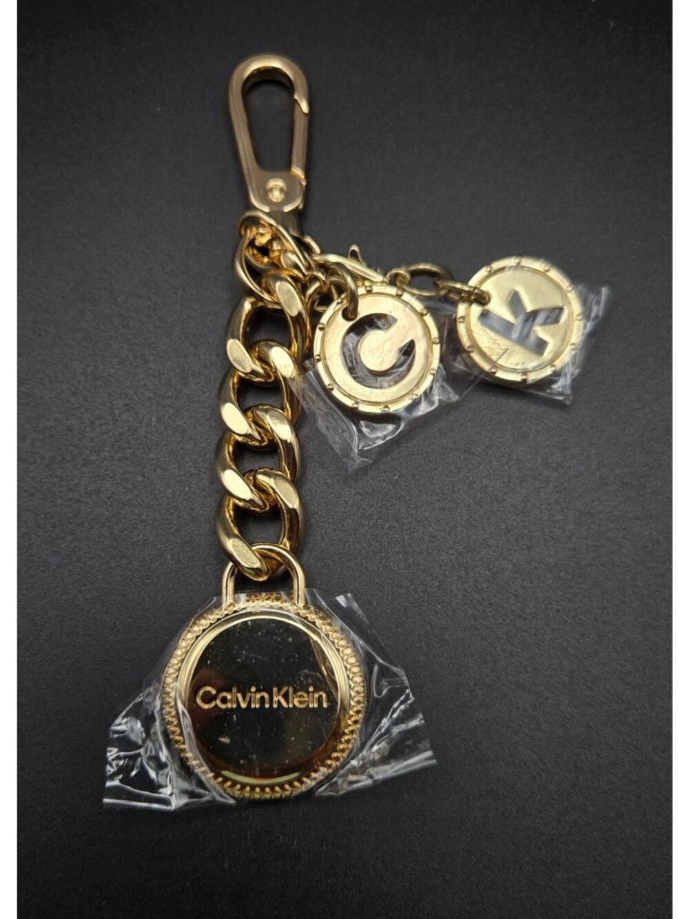 Calvin Klein Gold-Tone Logo Keychain purse charm With Decorative Charms & Lobste